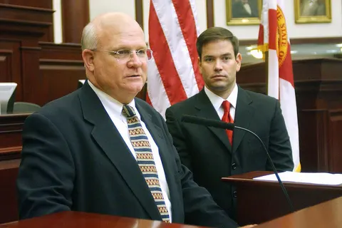 With Speaker Marco Rubio, R-Miami, at his side, right, Speaker pro tempore Dennis K. Baxley, R-Ocala, left, compliments House staff for their years of service, April 4, 2007.