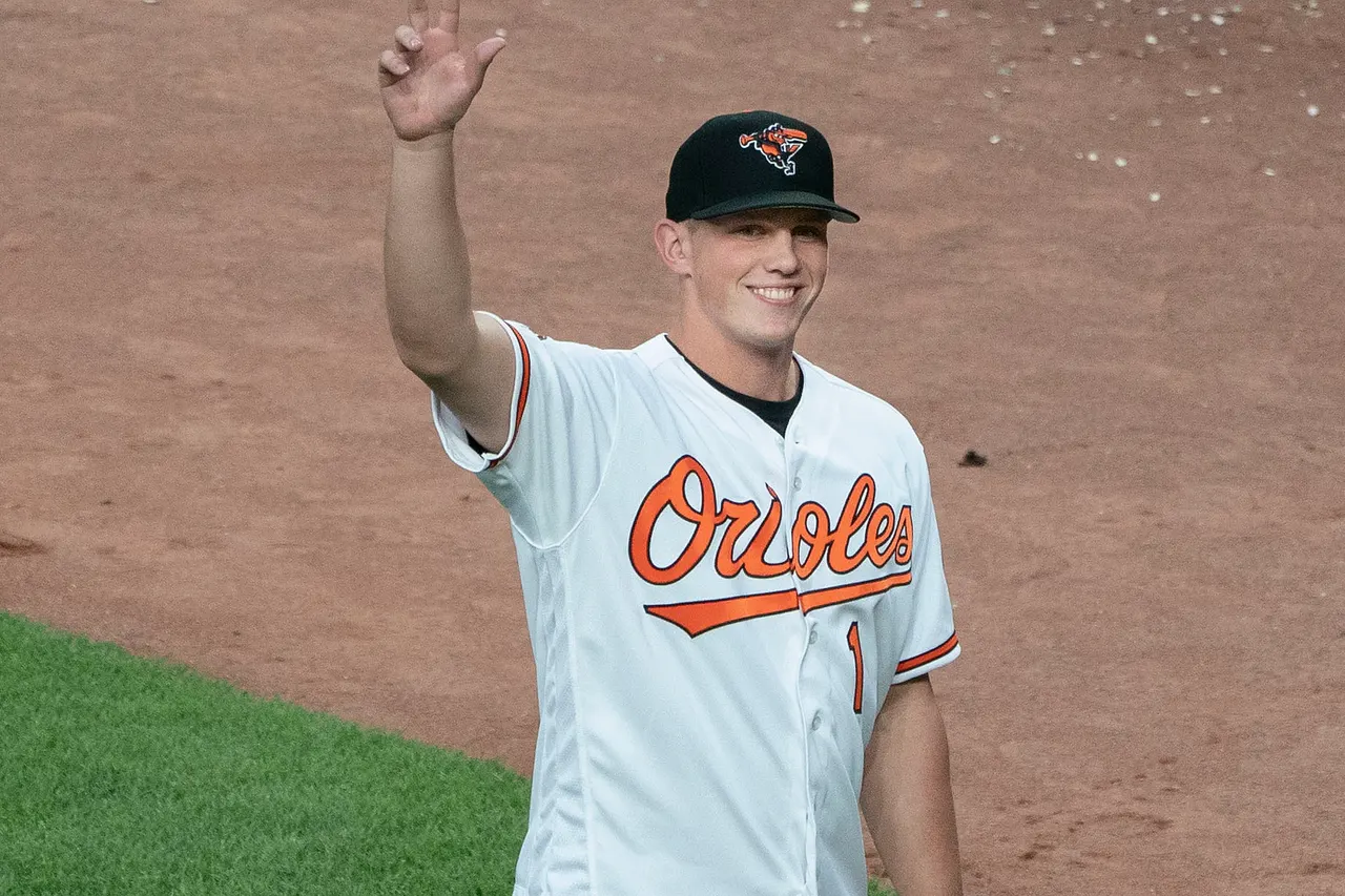 Adley Rutschman of the Baltimore Orioles acknowledges the crowd during a game at Oriole Park at Camden Yards on June 25, 2019 in Baltimore, Maryland.