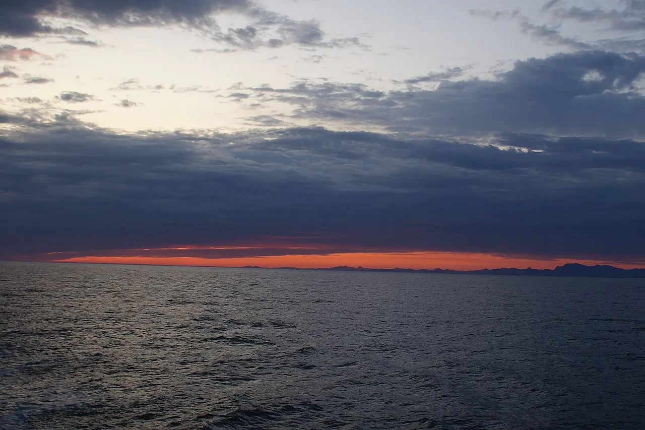 Past sunset at Labrador Sea, off the coast of Paamiut, Greenland. Photographed from the top deck of Sarfaq Ittuk of Arctic Umiaq Line.