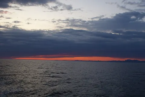 Past sunset at Labrador Sea, off the coast of Paamiut, Greenland. Photographed from the top deck of Sarfaq Ittuk of Arctic Umiaq Line.