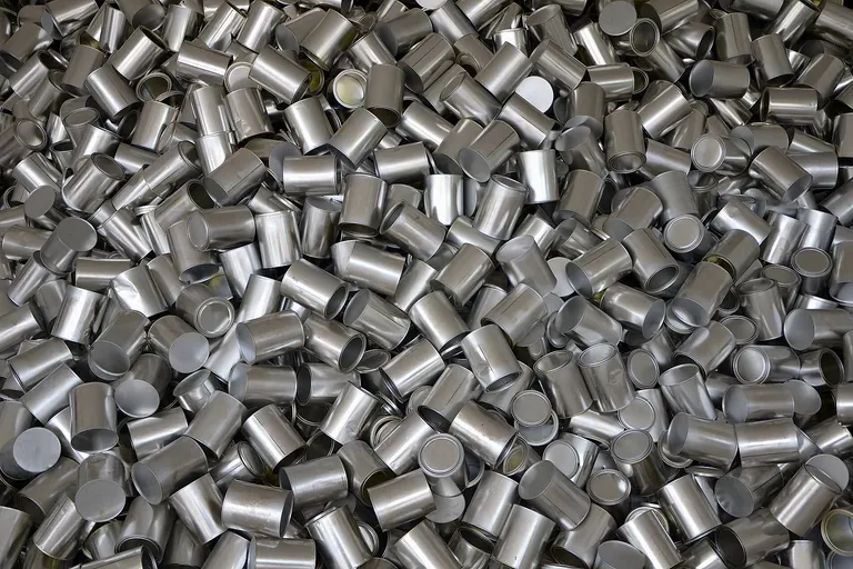 Heap of cans, symbolizing unrestrained consumption, outside the South Korea Pavilion of Expo 2015 in Milan.