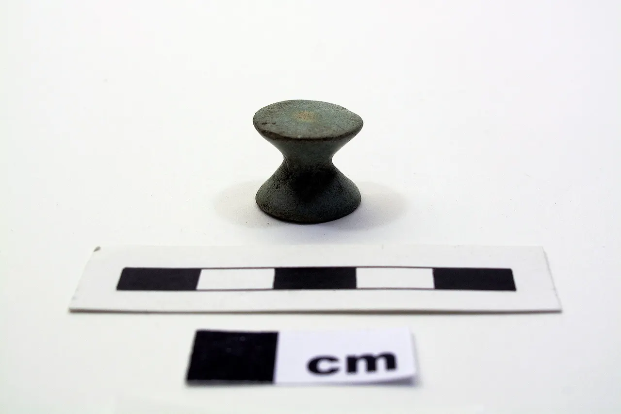 Pale green gaming piece. XVIII Dynasty.