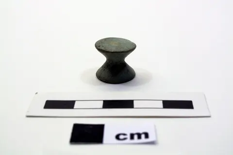 Pale green gaming piece. XVIII Dynasty.