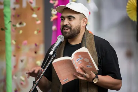 Omar Musa reads to an Audience at the Jaipur Literature Festival event at Federation Square in Melbourne as part of the broader Asia TOPA festival.