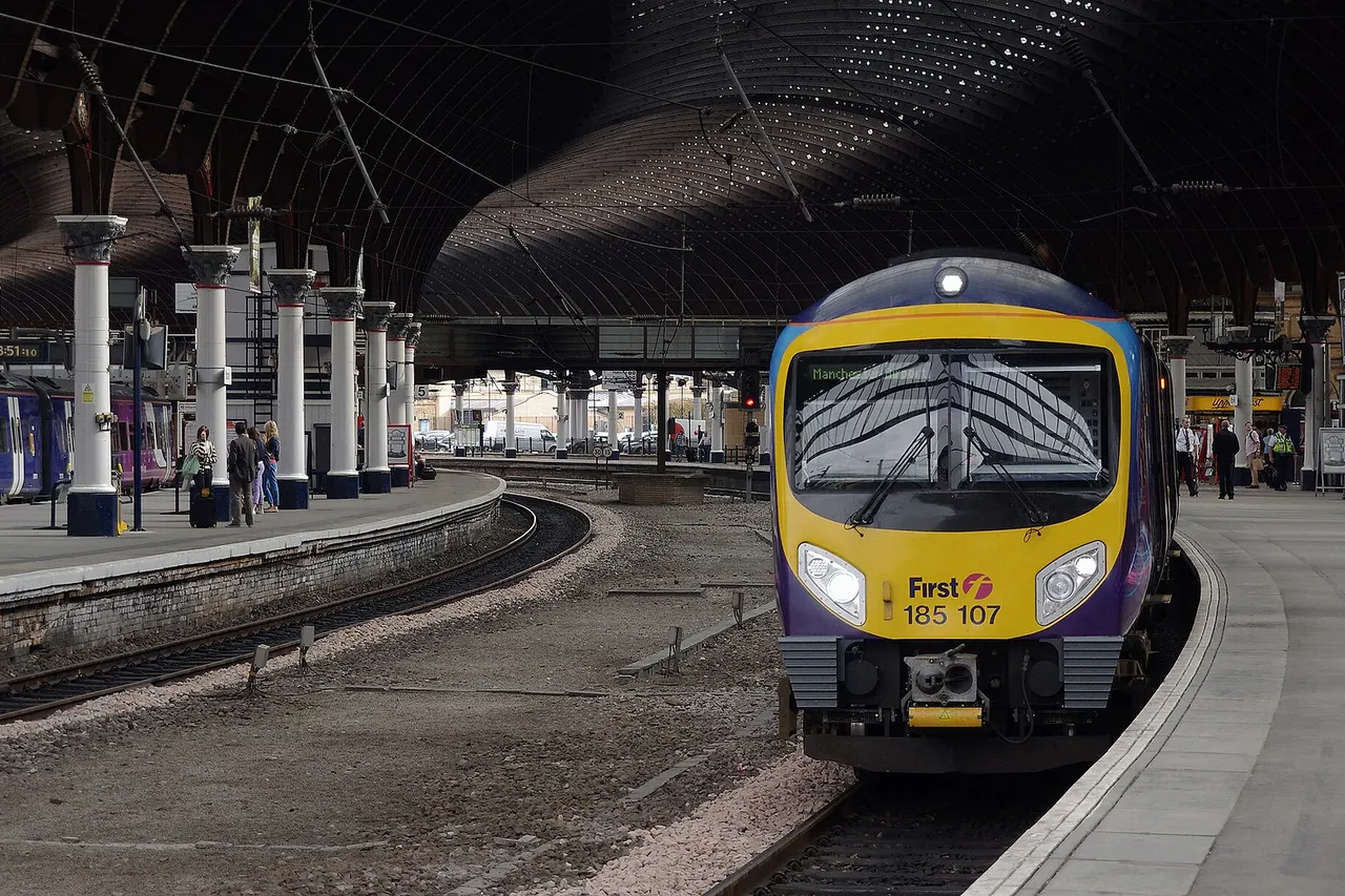 First TransPennine Express Desiro DMU 185107 at York with a service to Manchester Airport.