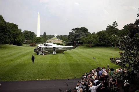 President Barack Obama boards Marine One on the South Lawn on the White House en route to Dulles International Airport , outside Washington, D.C., where he will board Air Force One for the flight to the Middle East and Europe, June 2, 2009. Air Force One departed from Dulles instead of Andrews Air Force Base as it needed a longer runway because of the fuel load required to make the trip non-stop to King Khalid International Airport in Riyadh, Saudi Arabia.