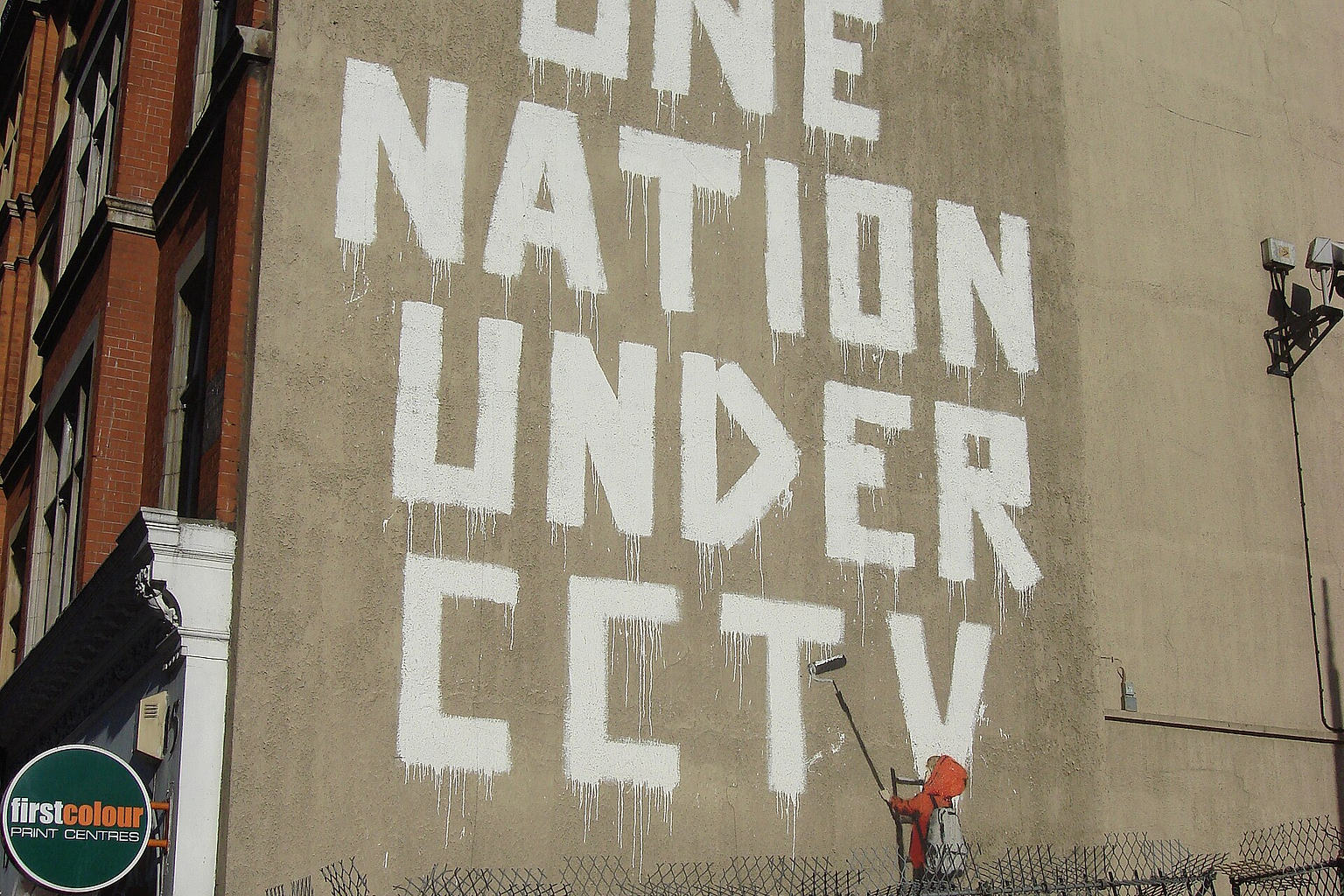 One nation under CCTV, Newman Street, London. By pseudo-anonymous, British graffiti artist Banksy