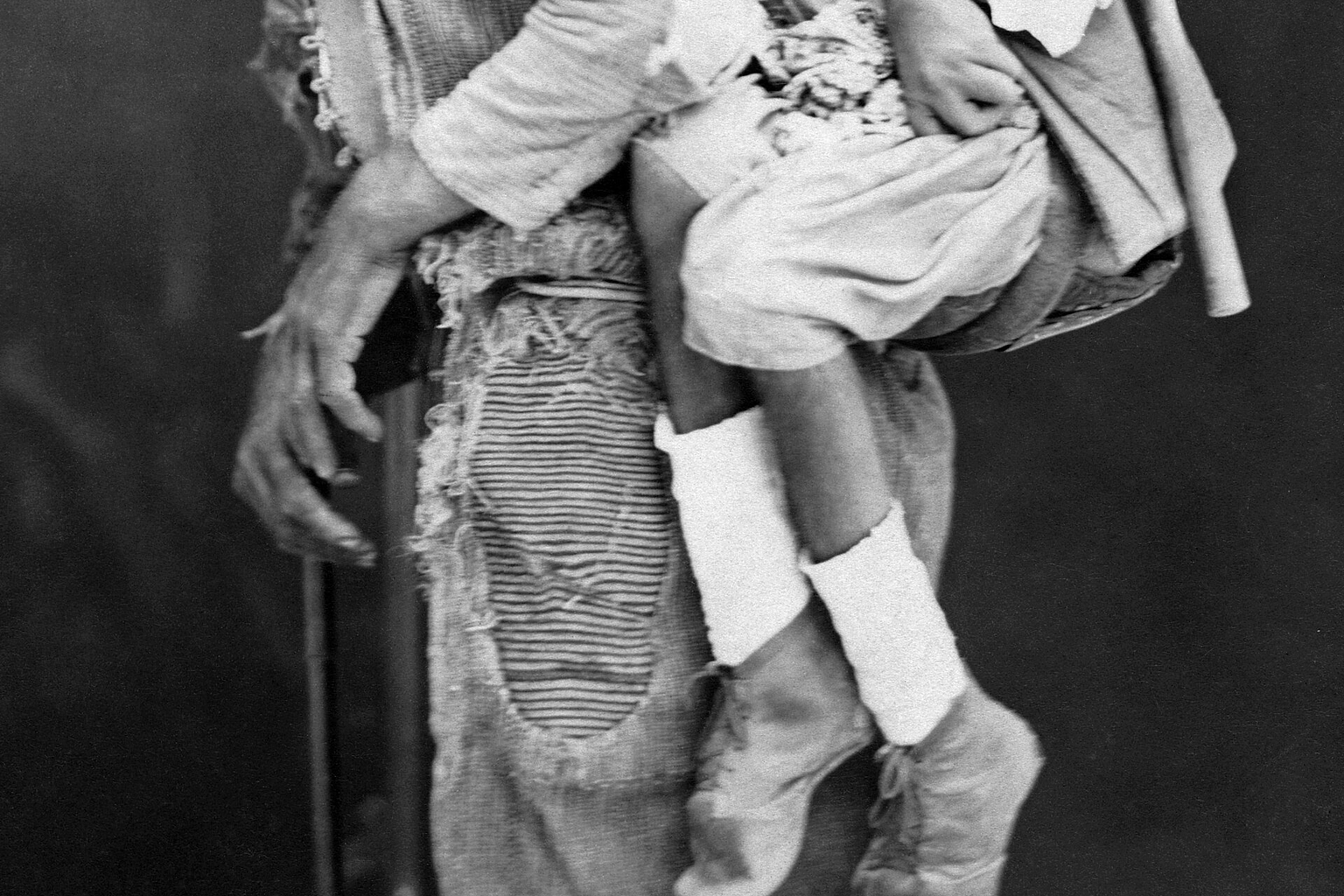 A blind man carrying a deformed man on his back in the Levant.