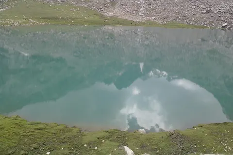 This Image has been captured at a height of 7000ft above sea level. its a natural lake having a crystal clear water to act like a mirror bestowing more beauty to the scenery.