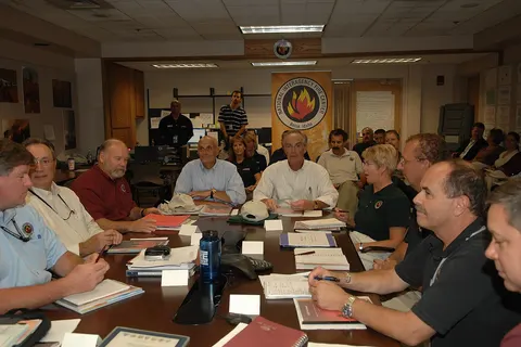 Complete assignment is listed as: Subject: Visit of Secretary Dirk Kempthorne to the National Interagency Fire Center in Boise, Idaho, [where he joined Homeland Security Secretary Michael Chertoff, Idaho Lieutenant Governor Jim Risch, and other officials for meetings, tours of the facility and surrounding area, and press conference on fire season preparations] Photographer: Tami Heilemann--Interior Staff