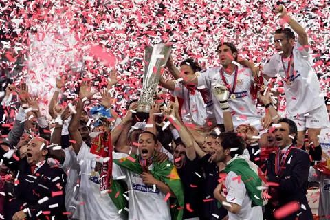 Players of Sevilla FC celebrate with the UEFA Cup trophy after the UEFA Cup soccer final against Middlesbrough FC at the Philips Stadium in Eindhoven, Netherlands, Wednesday 10 May 2006. Sevilla won 4-0.