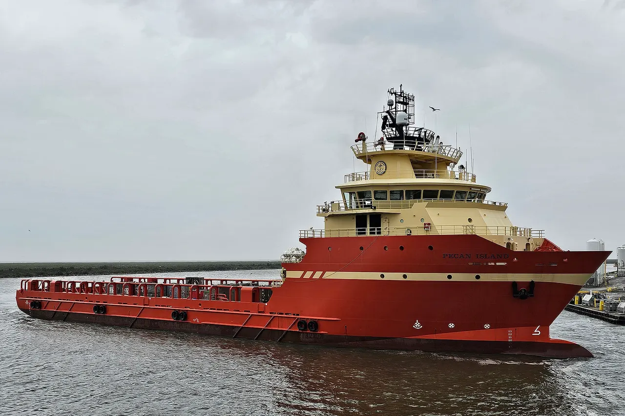 Offshore supply vessel Pecan Island underway on Bayou Lafourche in Port Fourchon, Louisiana. Vessel owned by Edison Chouest.