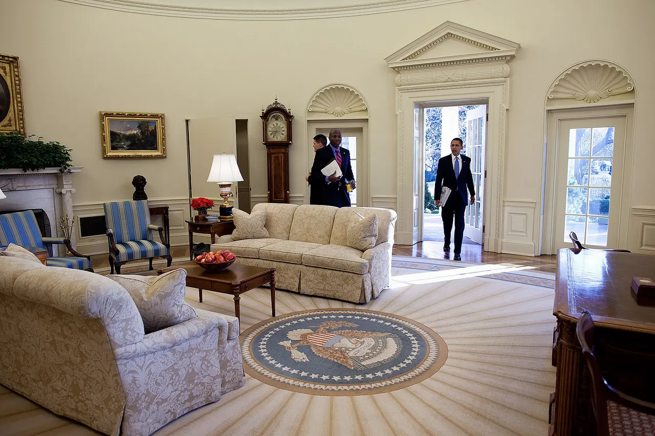 Barack Obama first enters in the Oval Office as president of the United States, for his first full day in office, Jan. 21, 2009. His Personal Aide Reggie Love stands nearby.