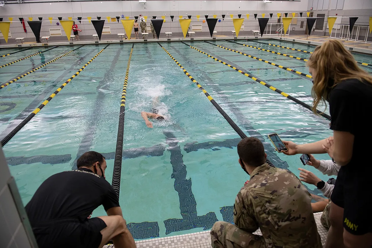 The Cadet Swim Team participates in the Patriot Games Swim Relay in Arvin Gym to receive 25 points credit as part of the competition with the U.S. Naval Academy during a two-day event at the United States Military Academy at West Point, New York on Dec. 10, 2020. Due to COVID-19, each team will participate at their own perspective swimming pools. For the competition to count, each team member swims 50 meters in an Olympic size swimming pool, and the lowest total time wins. (U.S. Army photo by Bryan Ilyankoff, USMA West Point Public Affairs/released)