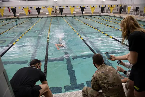 The Cadet Swim Team participates in the Patriot Games Swim Relay in Arvin Gym to receive 25 points credit as part of the competition with the U.S. Naval Academy during a two-day event at the United States Military Academy at West Point, New York on Dec. 10, 2020. Due to COVID-19, each team will participate at their own perspective swimming pools. For the competition to count, each team member swims 50 meters in an Olympic size swimming pool, and the lowest total time wins. (U.S. Army photo by Bryan Ilyankoff, USMA West Point Public Affairs/released)