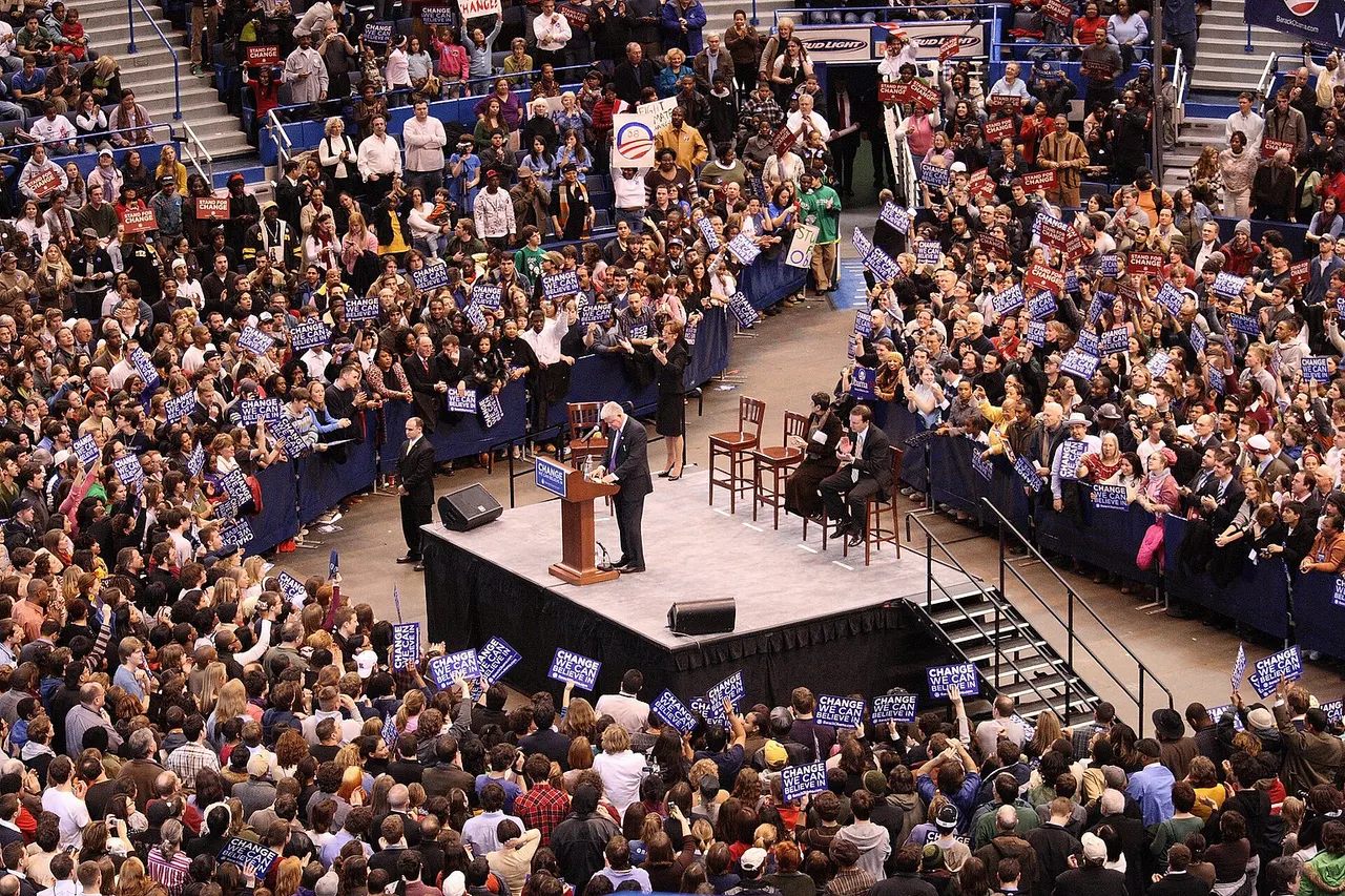 Representative John B. Larson of Connecticut 1st Congressional district, speaking before the crowd at a rally the presidential campaign of Senator Barack Obama in Hartford, Connecticut. Representatives Rosa DeLauro and Chris Murphy are seated onstage.