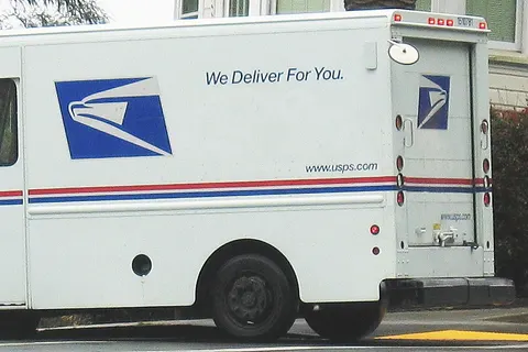 United States Postal Service delivery truck in San Francisco residential area. Location: San Francisco, CA.