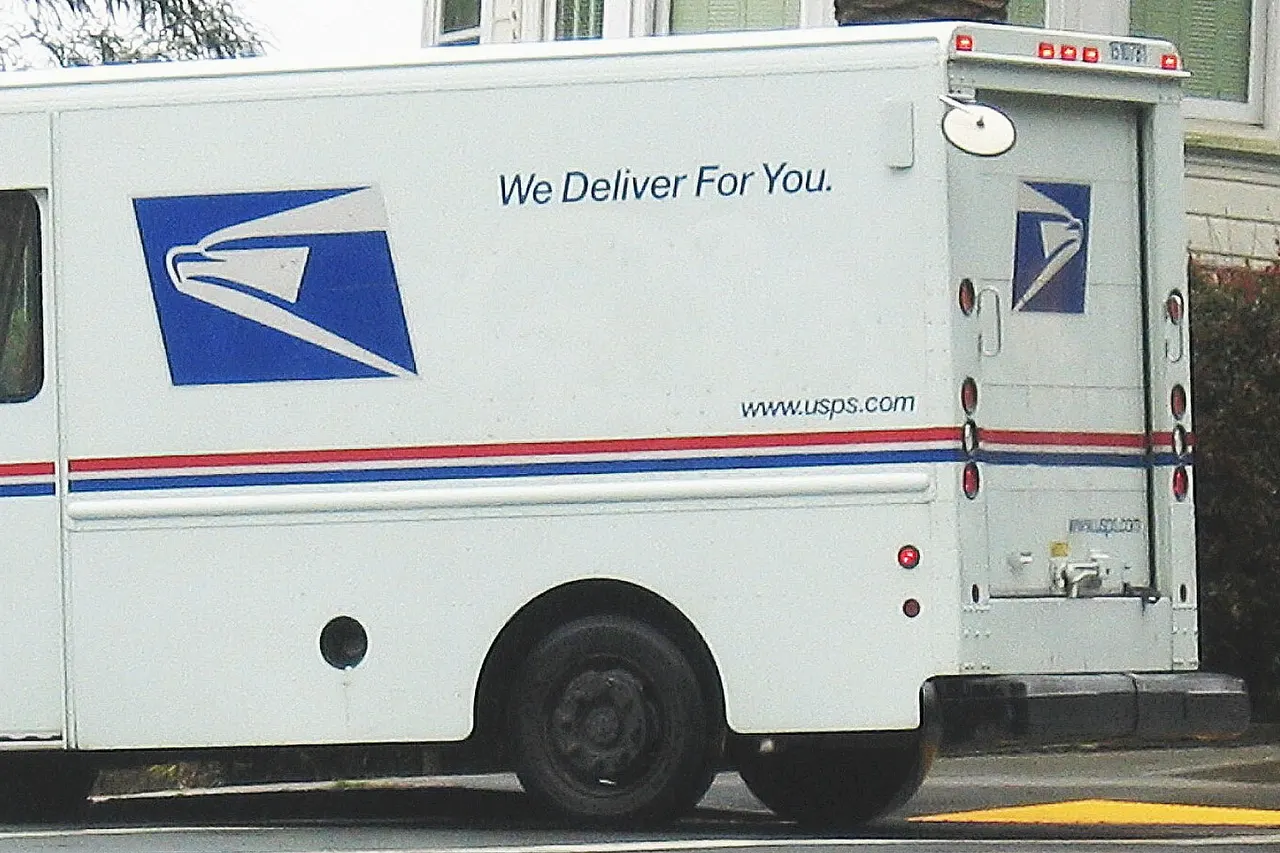 United States Postal Service delivery truck in San Francisco residential area. Location: San Francisco, CA.