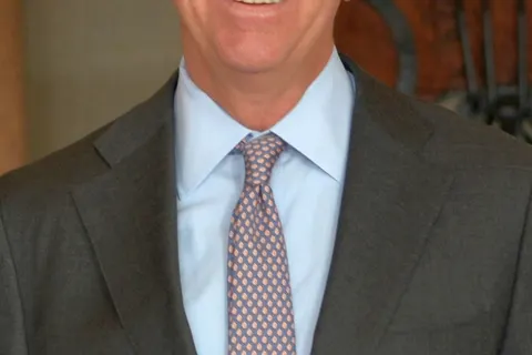 Governor Ned Lamont of Connecticut, official portrait. He is in the Connecticut state capitol, and behind him is the Connecticut liberty bell.