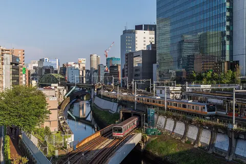 Tokyo Metro 02 series nr. 618 (below) on the Marunouchi Line crosses the Kanda river, while, above, a E233 set of JR East on the Chuo main line just leaves Ochanomizu. If you look closely, you can also spot a E231 set of JR east on the Sobu line, behind the platform. Photo taken at Ochanomizu, Tokyo, Japan.