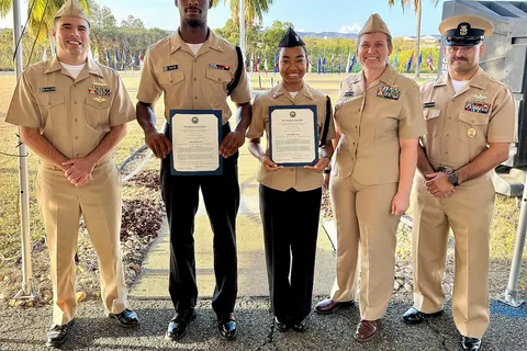 GUANTANAMO BAY, Cuba –Hospital Corpsman 2nd Class Austin Pate and Hospital Corpsman 3rd Class Damelah Fluker display their certificates of appointment after being promoted in rank by Capt. Tammy Servies, director of U.S. Naval Hospital Guantanamo Bay and commanding officer of U.S. Navy Medicine Readiness and Training Command, Guantanamo Bay, Mar. 28, 2025. Also pictured, Cmdr. Angel Calvo, acting executive officer, and Command Master Chief Francisco Moreno. The Meritorious Advancement Program allows commanding officers to recognize their best Sailors by advancing them when they are ready for the next level of responsibility. (U.S. Navy photo by Emily McCamy/released)