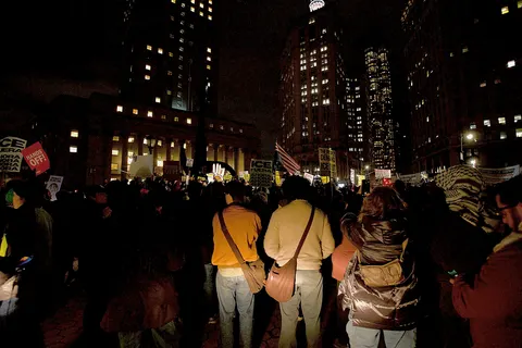 Protesters at Foley Square by the federal government building protesting the ICE killing of Renee Good hours earlier. People spoke at the monument, before walking around 26 Federal Plaza, and ending back at Foley Square.
