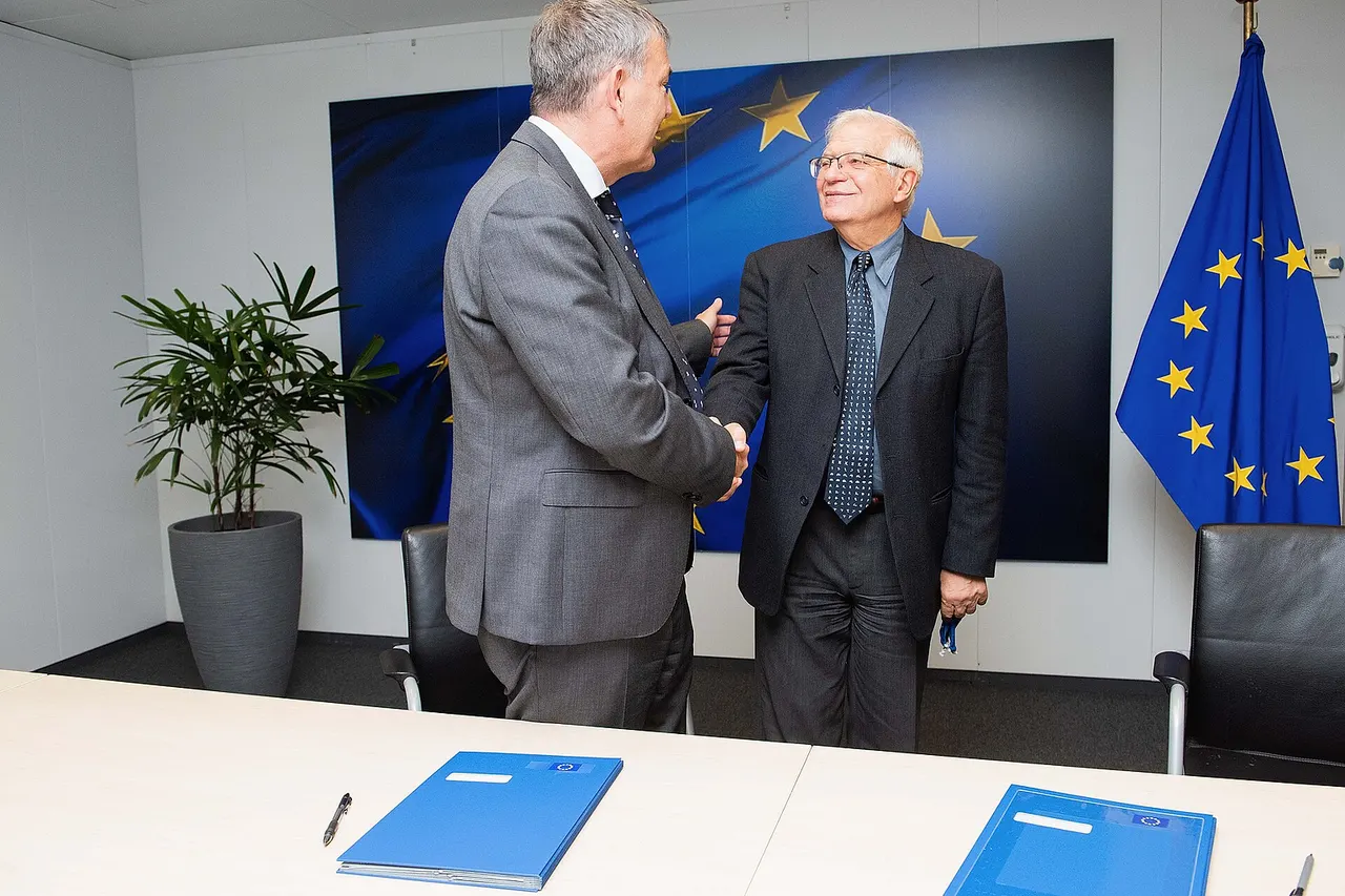 Handshake between Philippe Lazzarini, on the left, and Josep Borrell Fontelles
