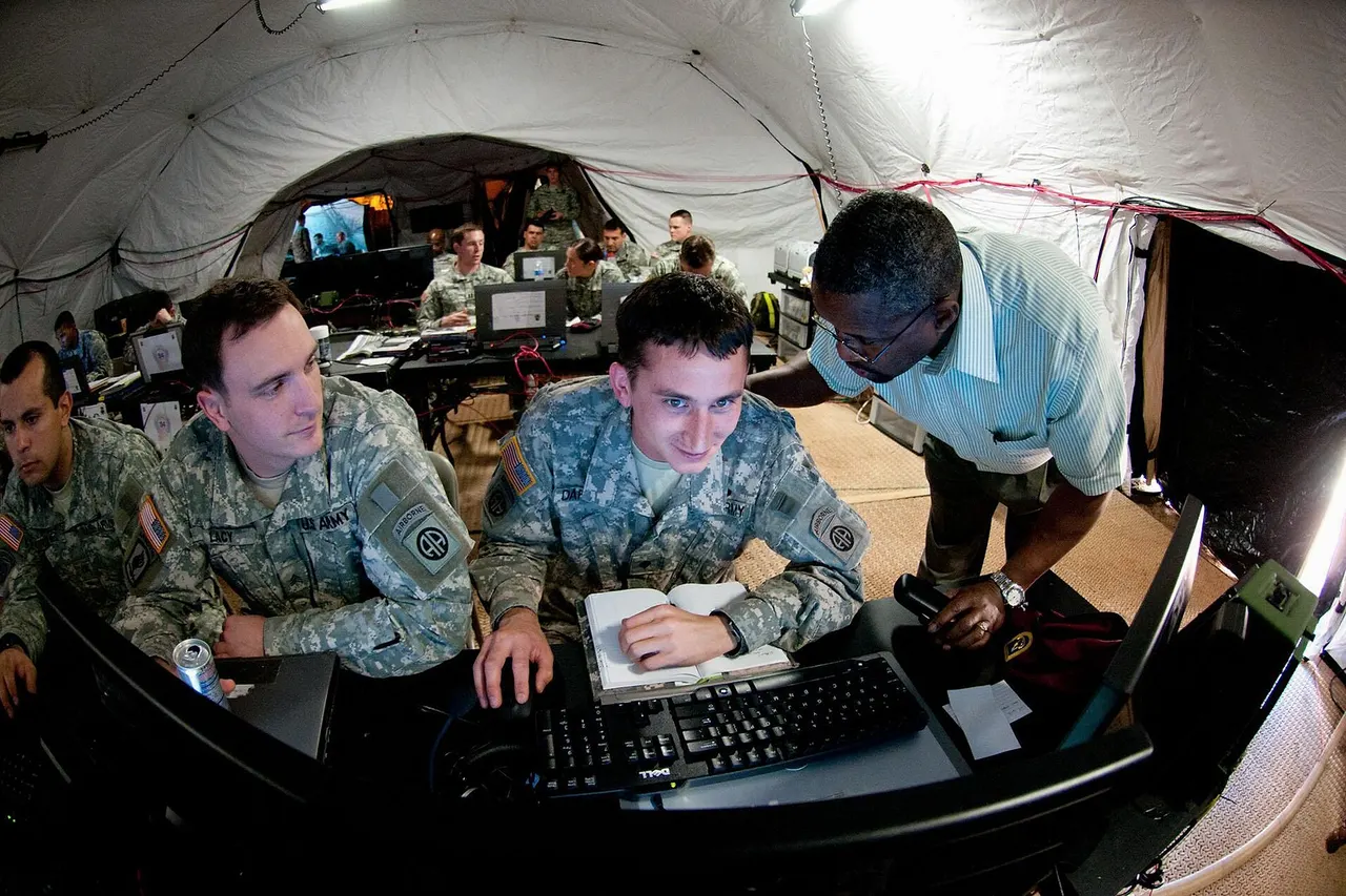 Spc. Trenton Dahlman, a fire support specialist with the 82nd Airborne Division’s 1st Brigade Combat Team, gets a lesson from a civilian trainer on how to use an Army Battlefield Command System for fire support during a tactical operations center exercise March 17, at Fort Bragg, N.C. The multi-week exercise was a chance for brigade staff to learn new systems and to integrate with other sections.